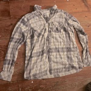 This is a slightly used flannel button up. It is soft it just needs ironing.